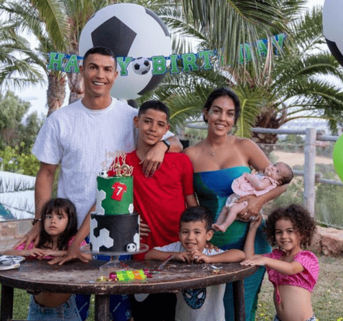 The Ronaldo family poses for a family photo while celebrating a birthday