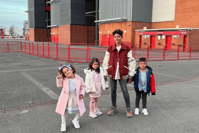 The children of Cristiano Ronaldo outside Old Trafford embodying family joy and football legacy.